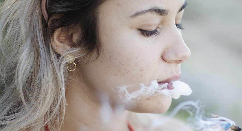 woman smoking legal weed in scarborough. buy Edible Gummies online.